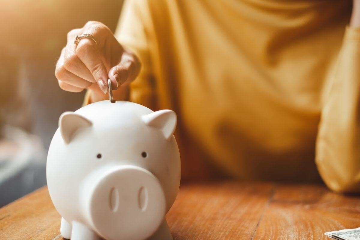 An image of a woman saving money.