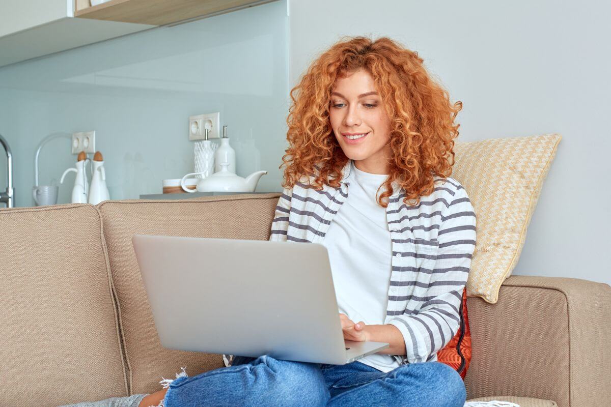 A picture shows a woman using a laptop.