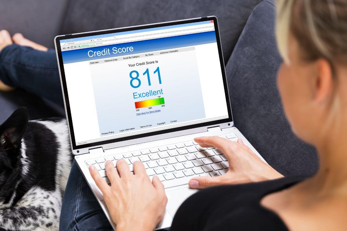 A picture of a woman checking her credit score.