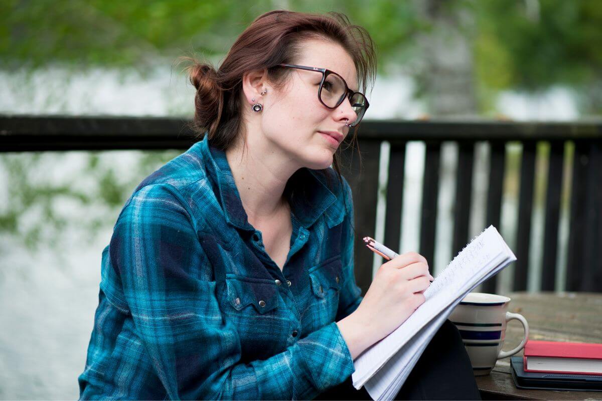 A picture of a woman making a list.
