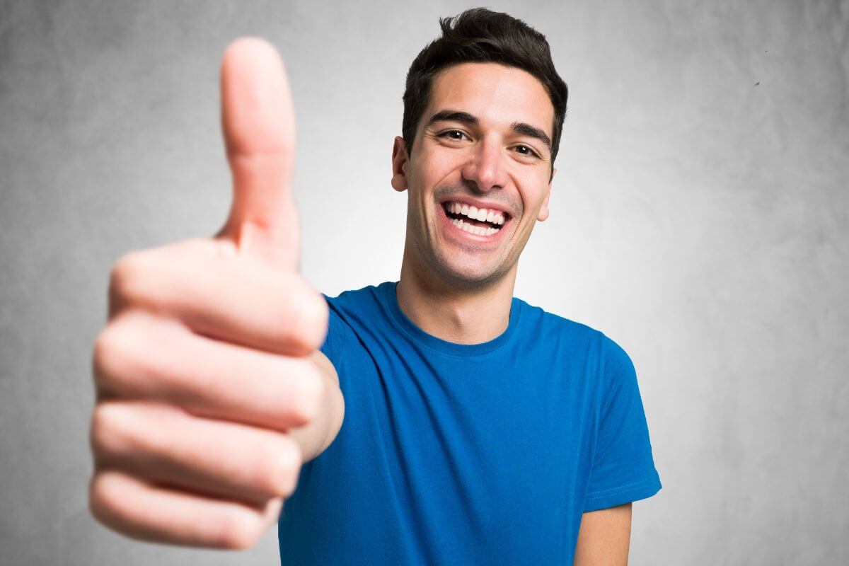 An image of a man who does a good sign.