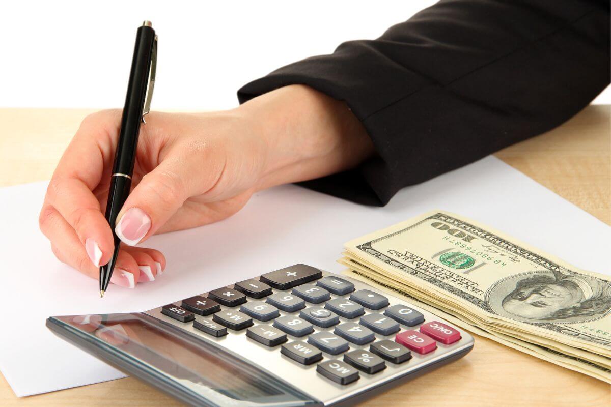 A picture shows a woman tracking her money.