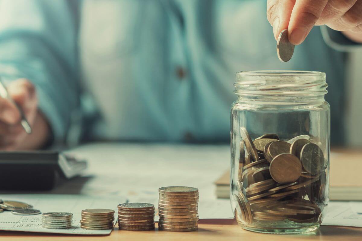 A picture of a woman saving money.