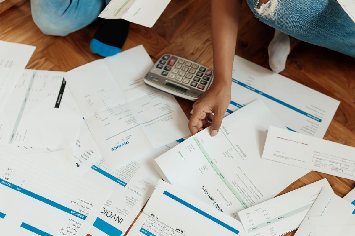 An image shows debt invoices.