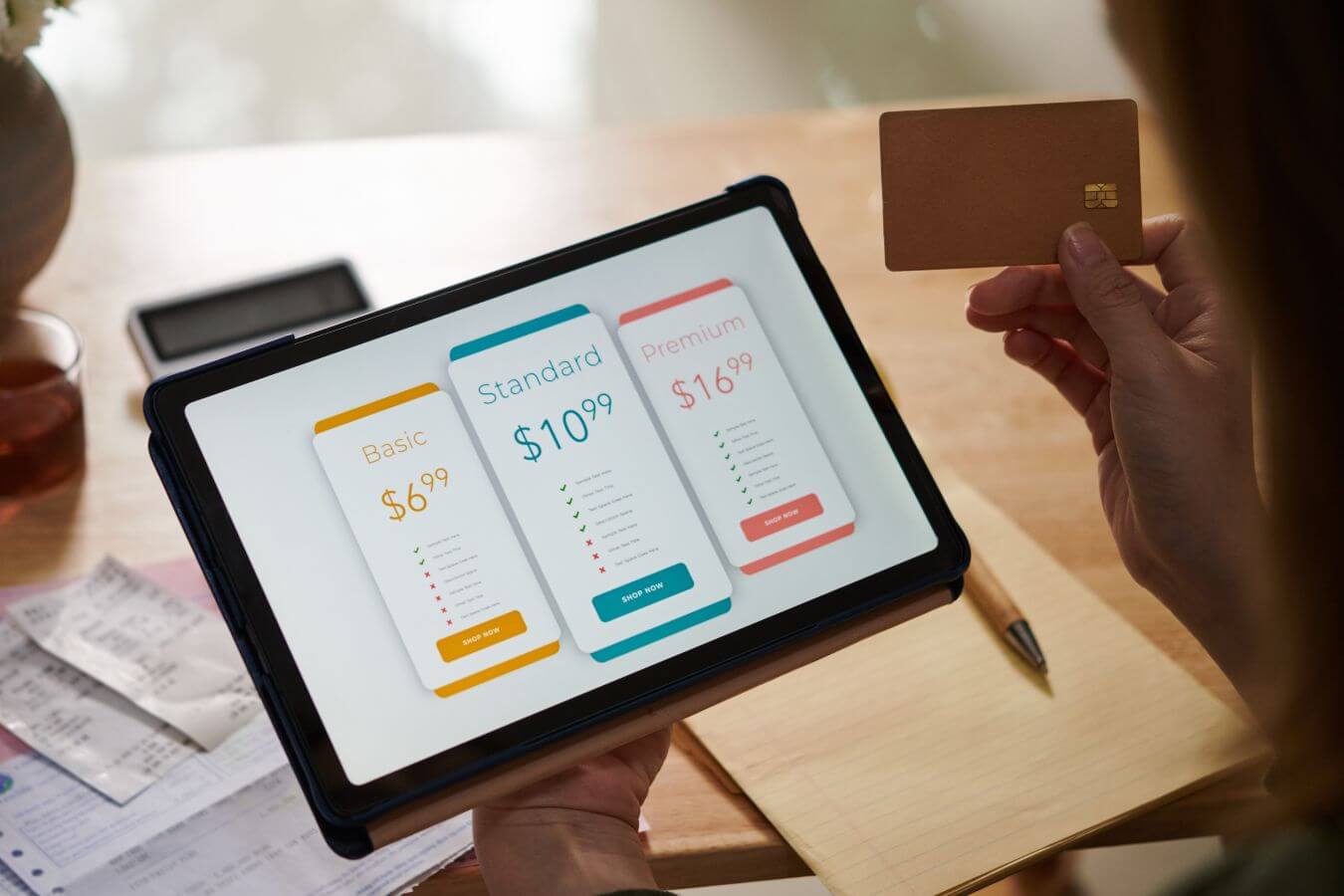 An image shows a woman working on her subscription.