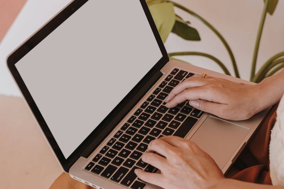 A picture of a woman using a laptop.