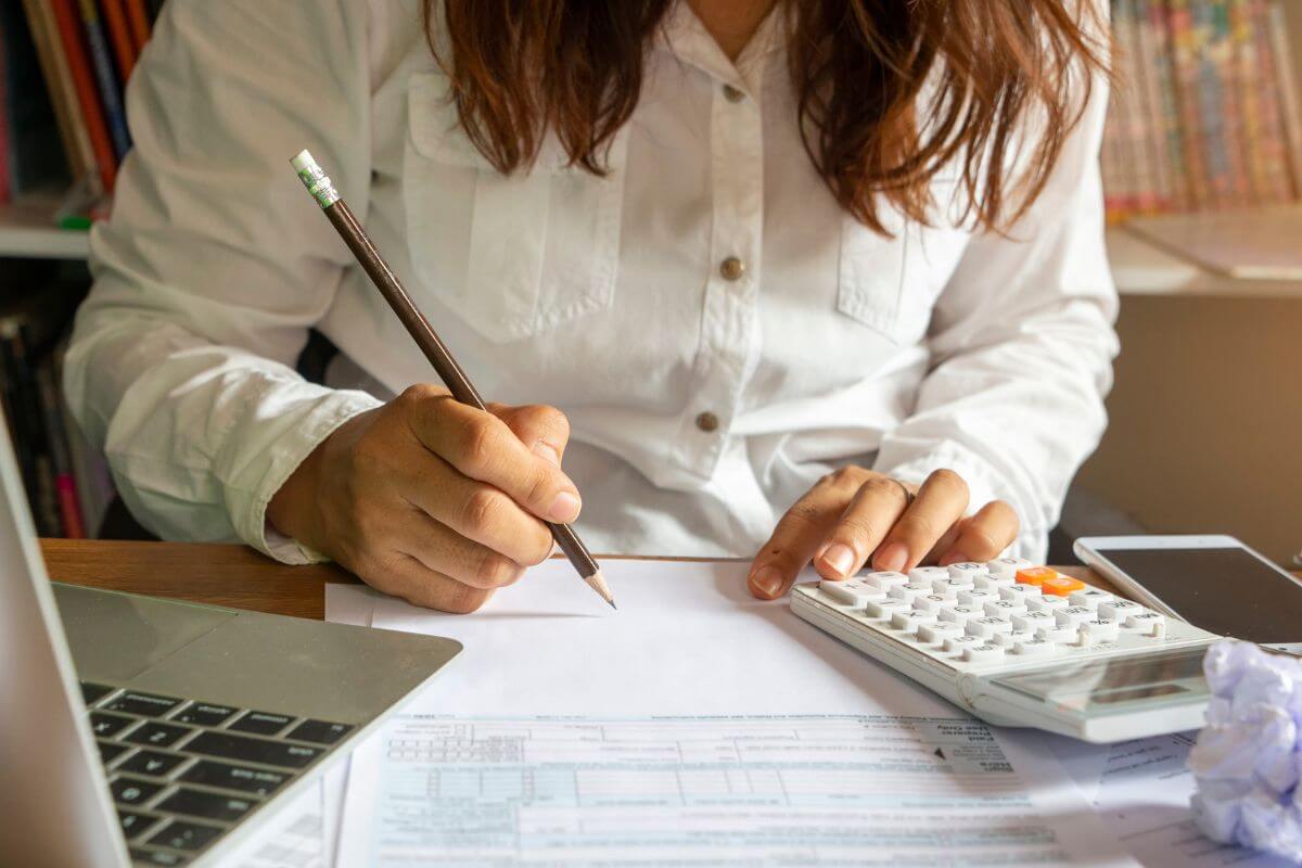 A picture of a woman reviewing her papers.