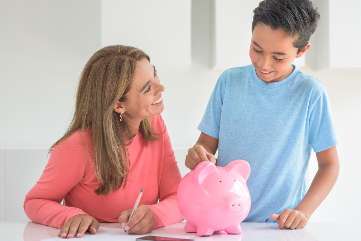 An image shows a mother and son saving money.