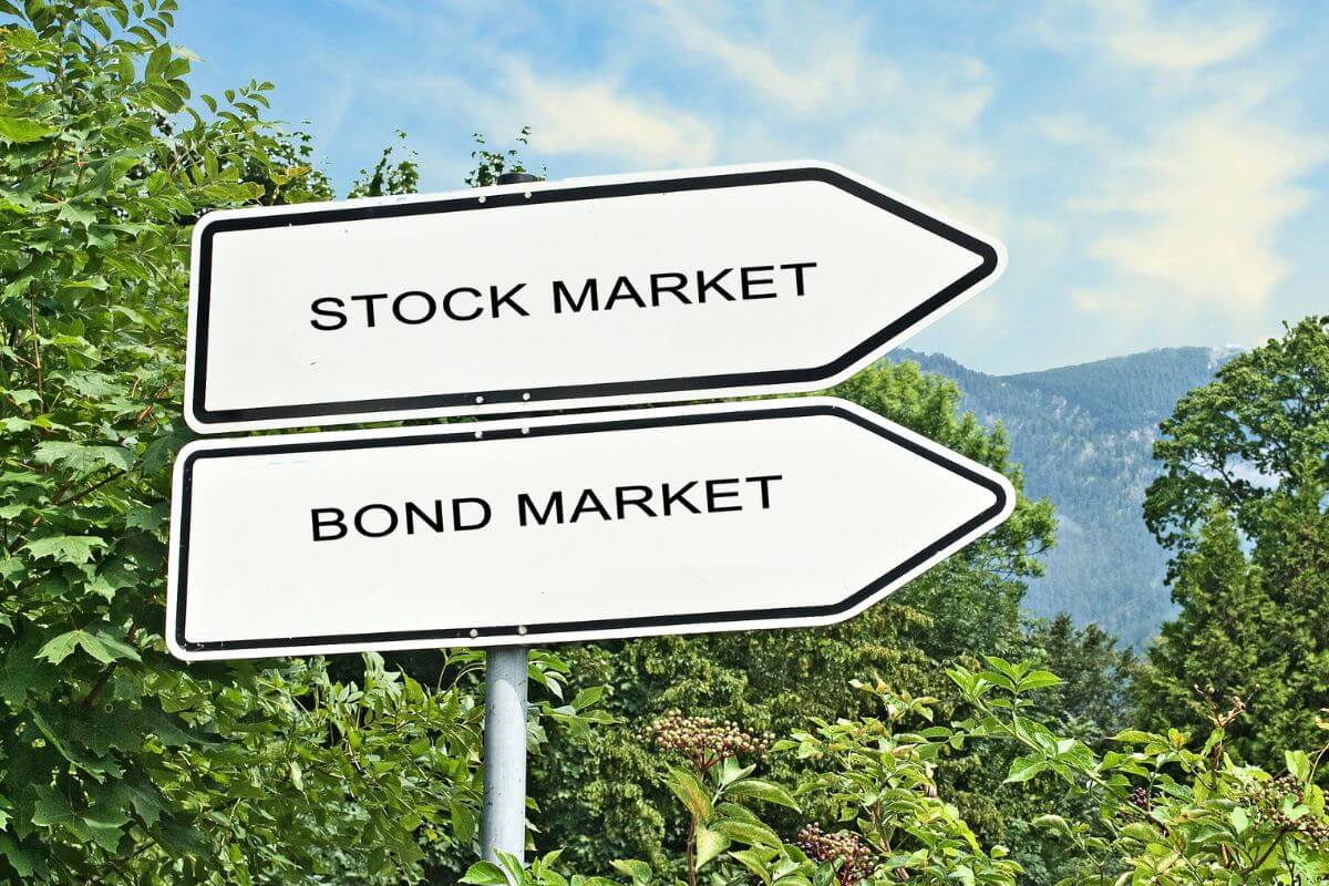An image shows the stock and bond market signage.
