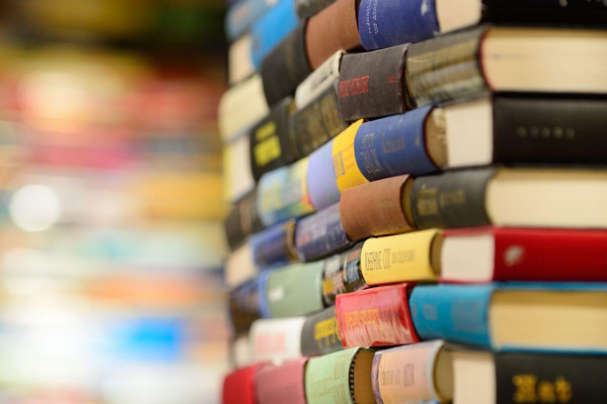 An image shows a pile of books.