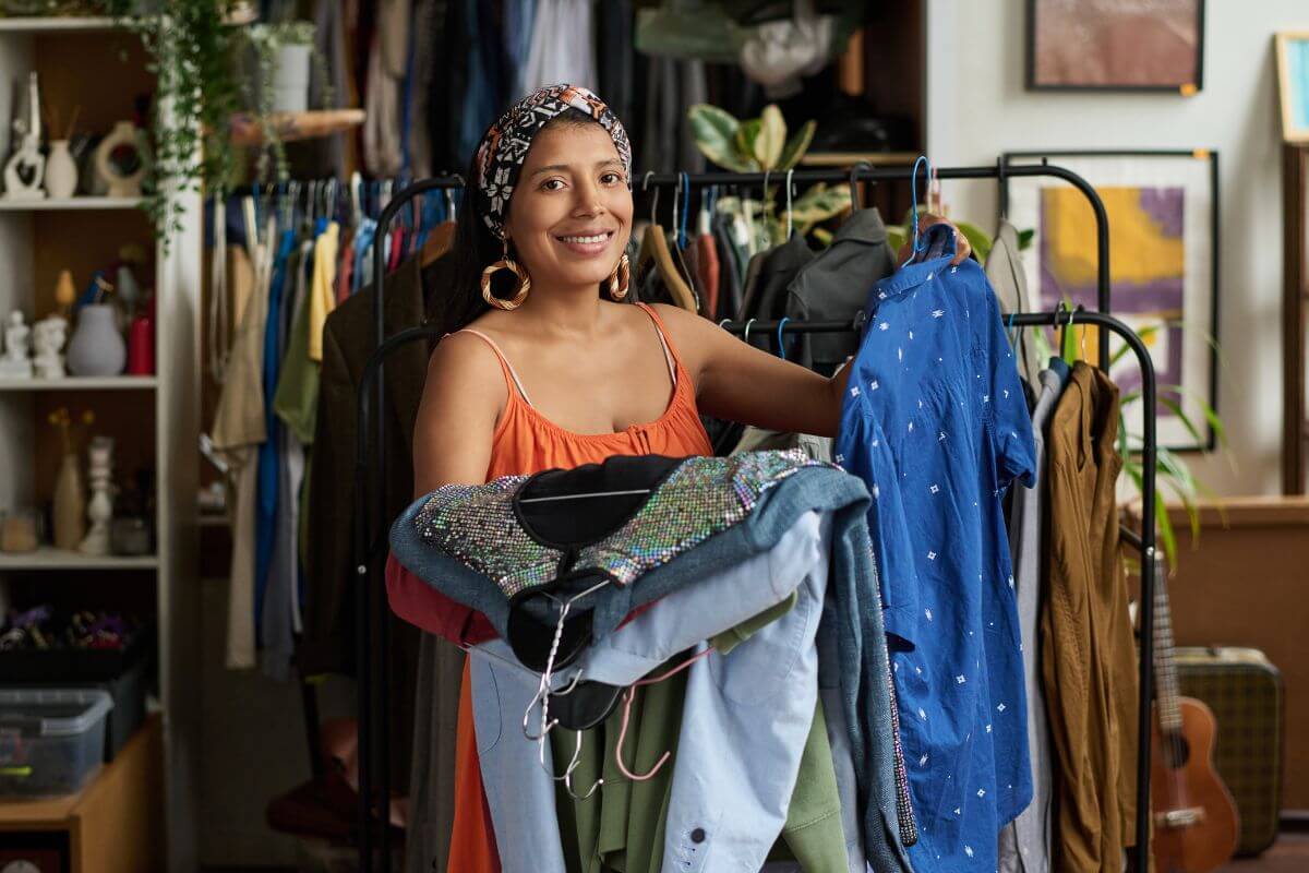 A picture of a woman shopping at the thrift store.