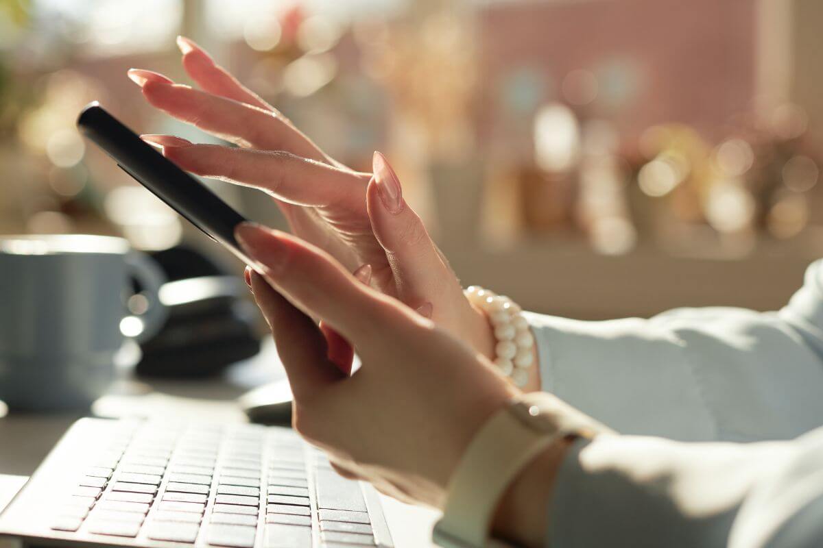 Picture of someone on a phone.