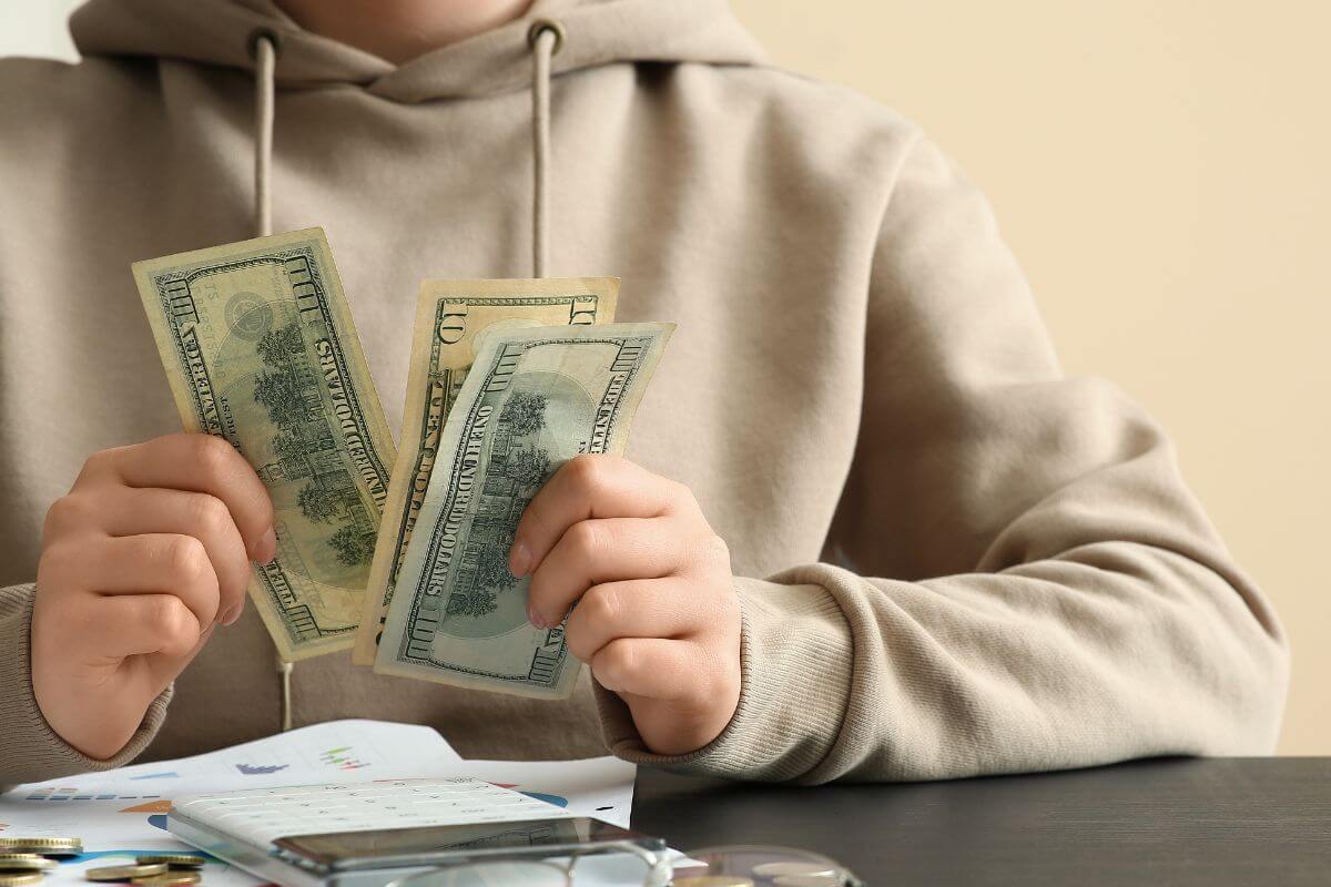 Picture of someone deciding how to spend cash.