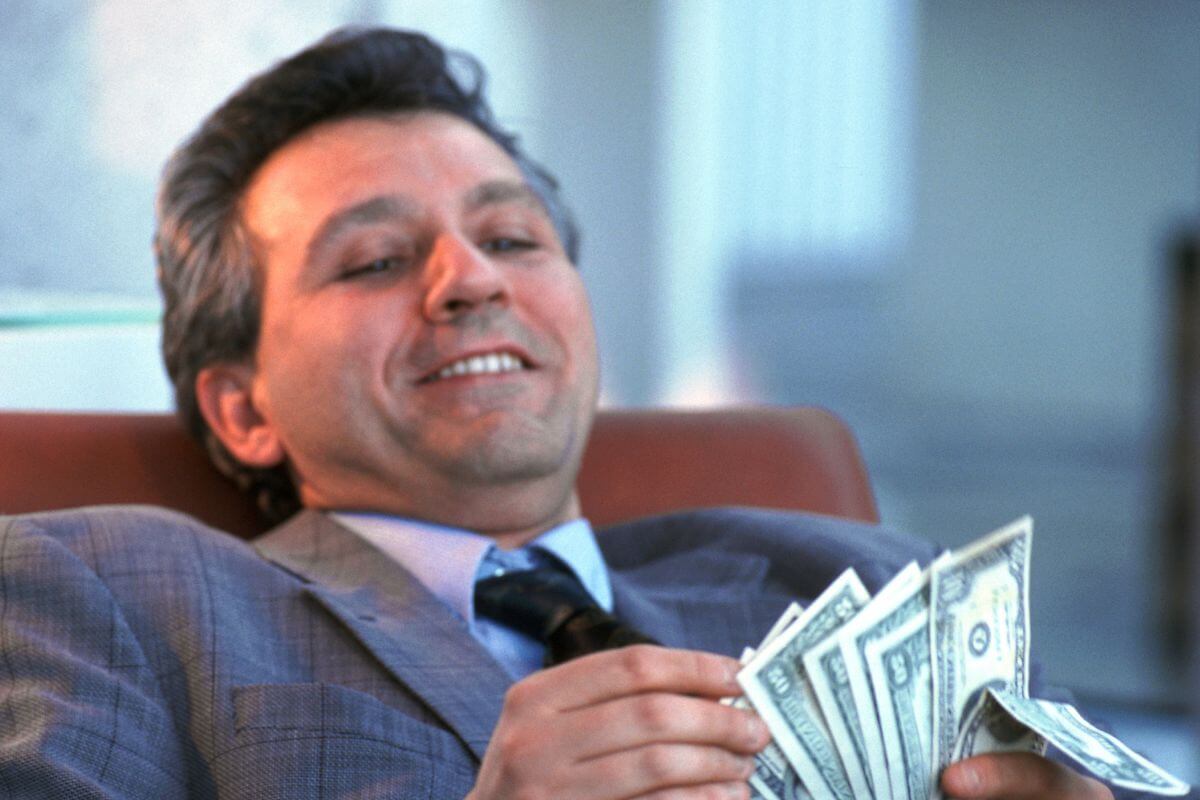 A picture of someone counting money.