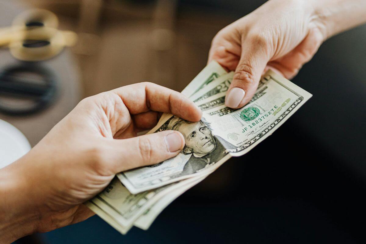 A picture of someone paying.