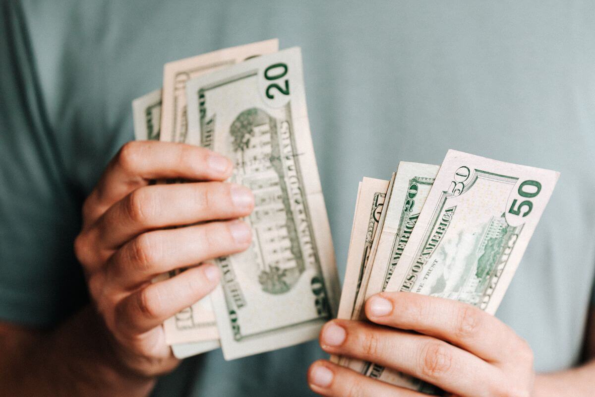 A picture of someone counting money.