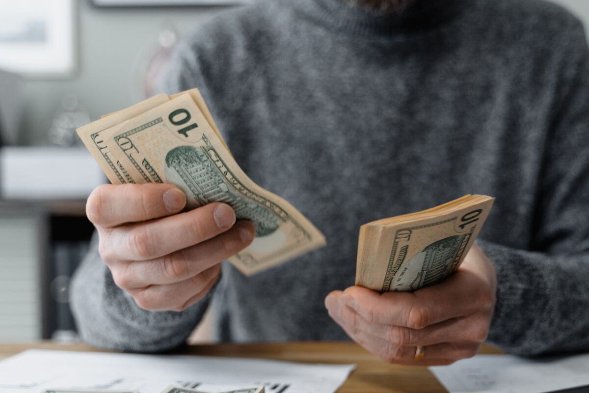 A picture of someone counting money.