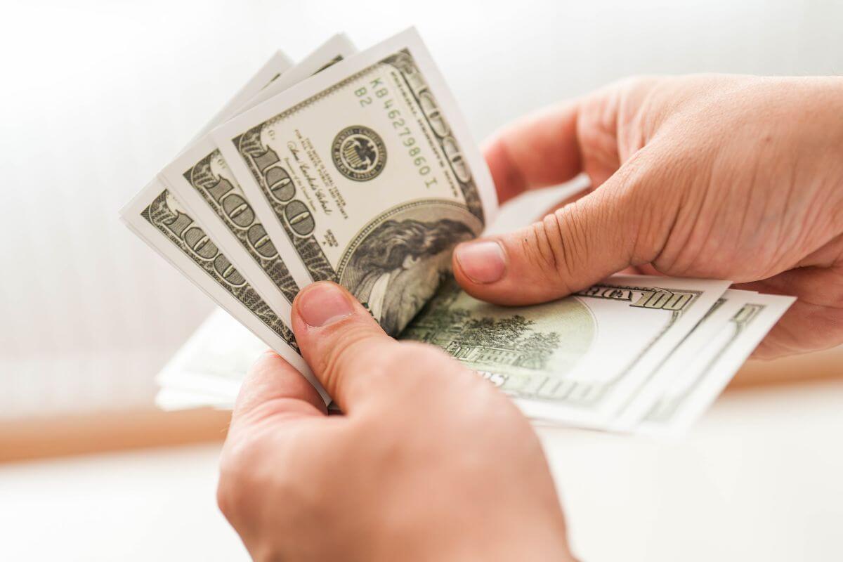 A picture of someone counting money.