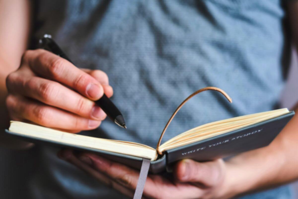 A picture of someone writing something. 