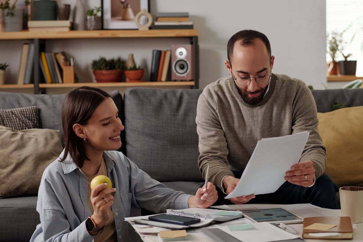 A picture of a couple leaning something. 