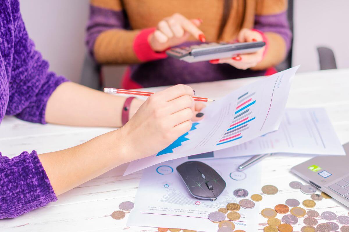 A picture of someone calculating their expenses. 