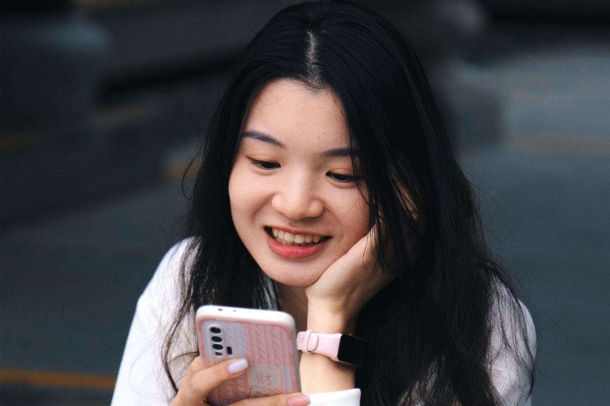 A picture of someone using their phone.