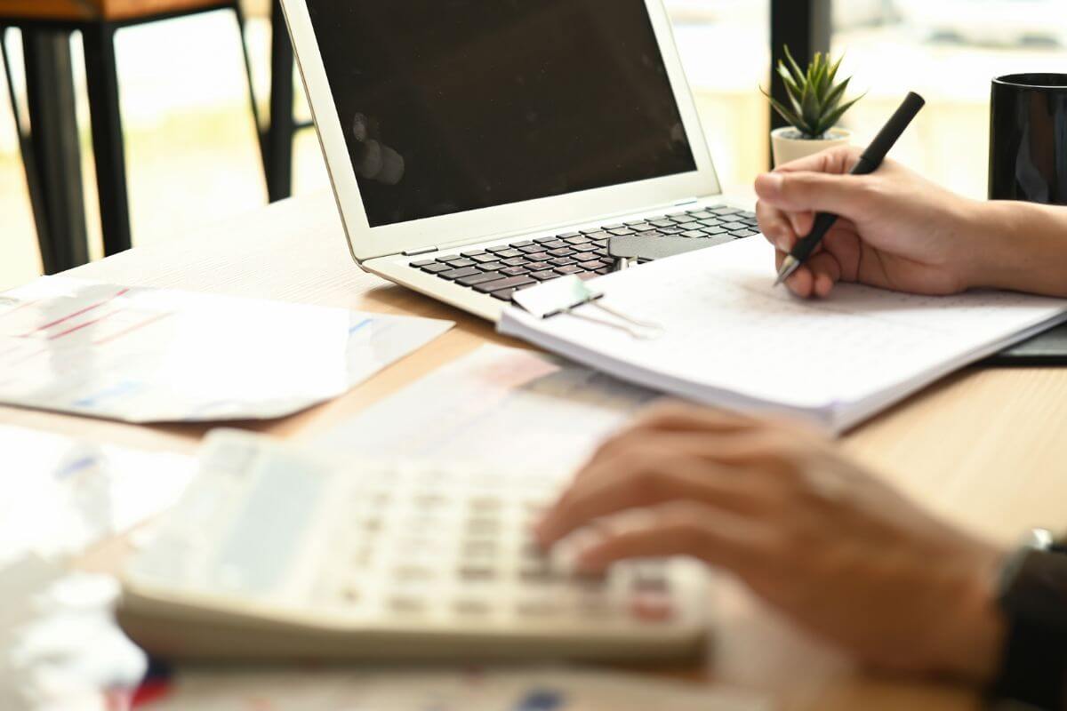 A picture of someone calculating something. 