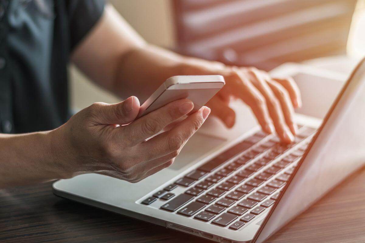 A picture of someone using their gadgets. 