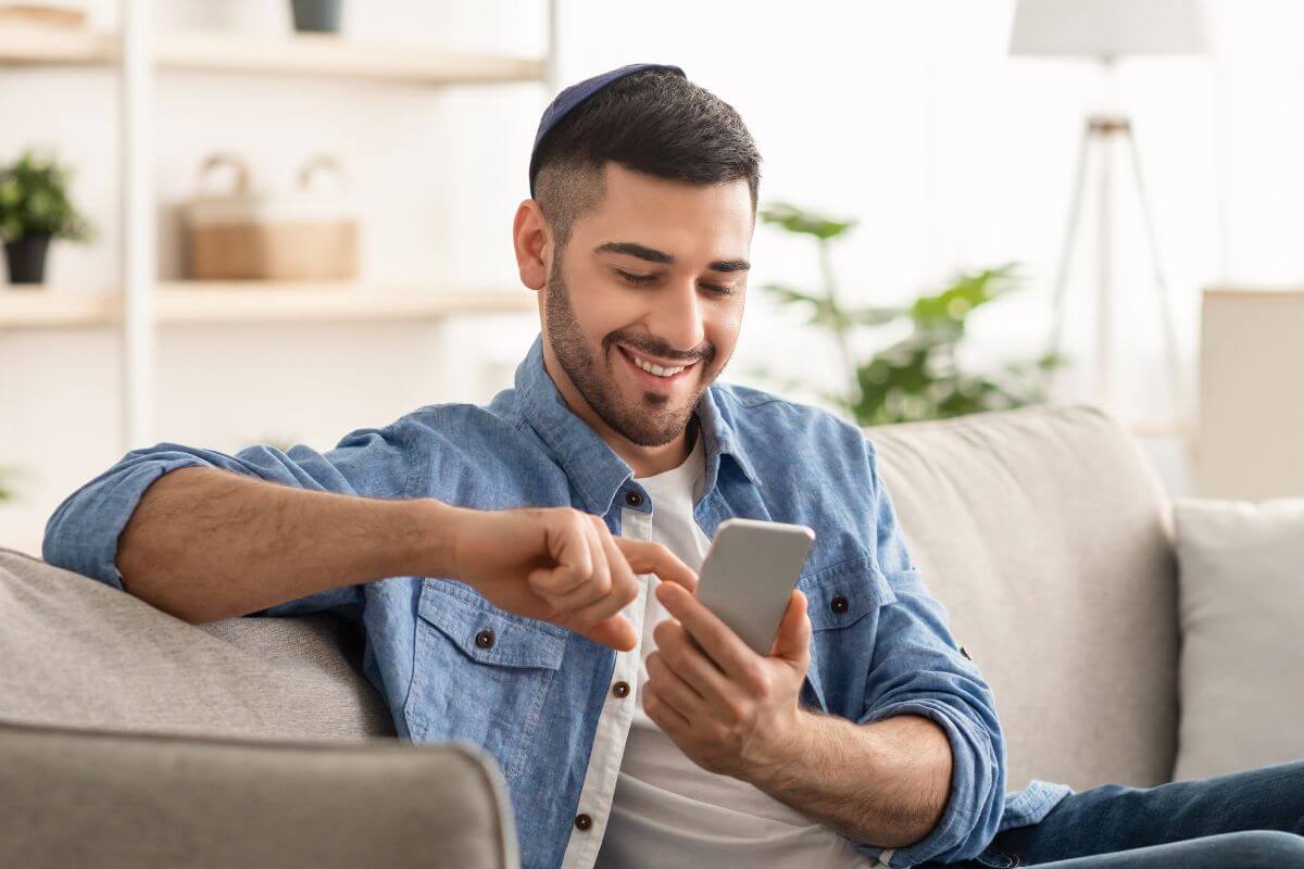 A picture of someone using their phone. 