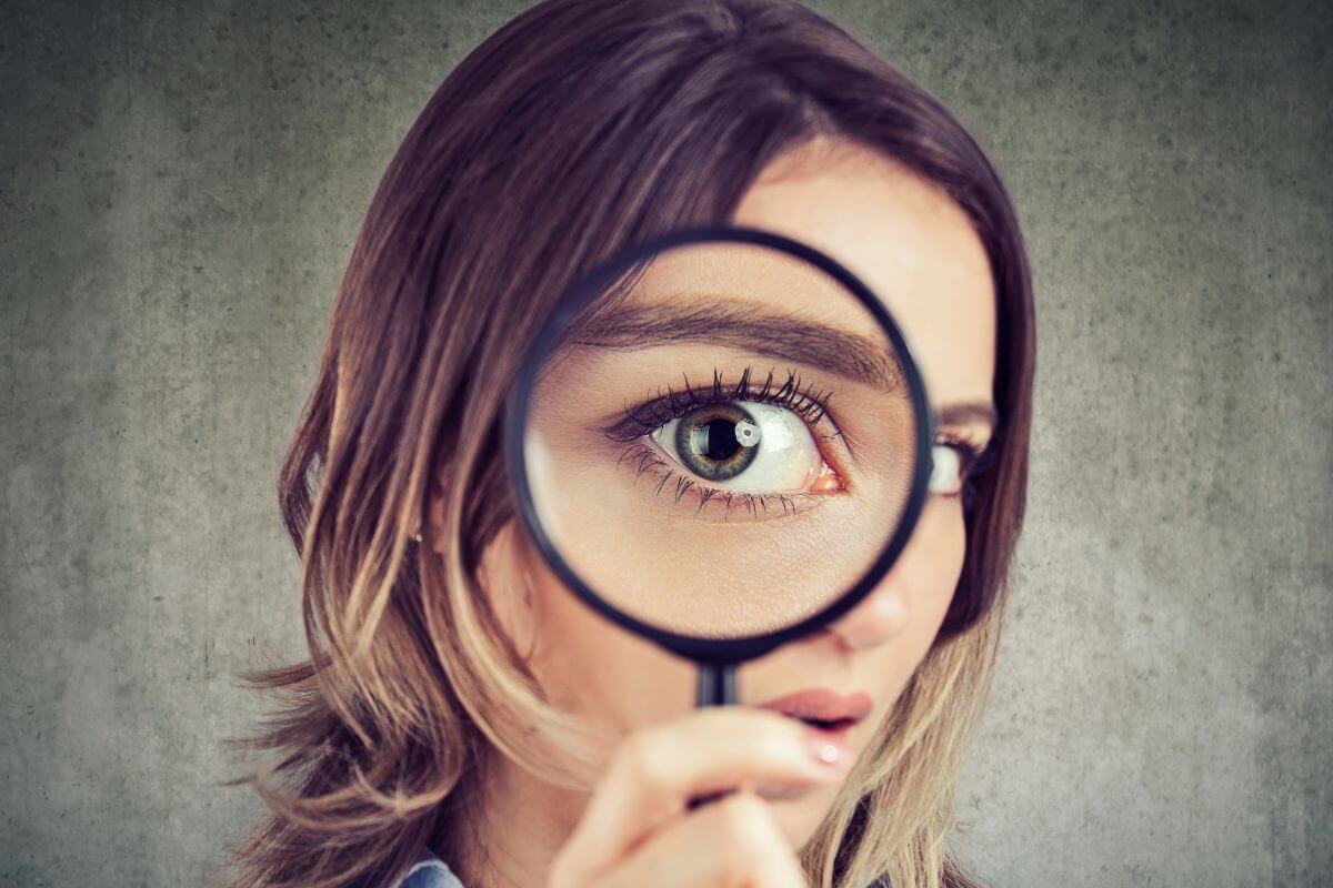 A picture of someone using magnifying glasses.