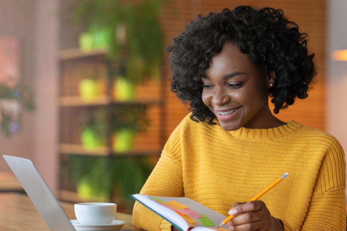 A picture of someone taking notes. 