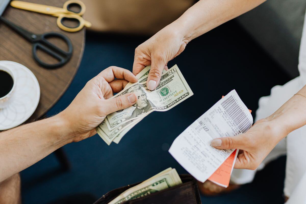 A picture of someone paying debt.