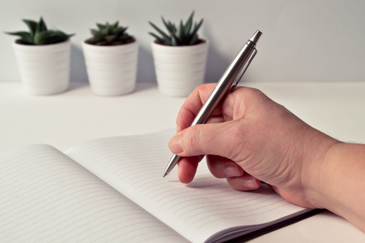 A picture of someone writing.