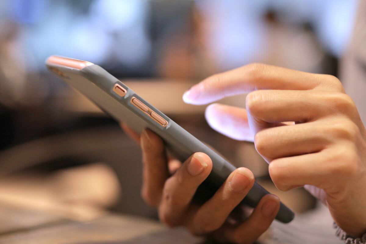 A picture of someone using their phone.