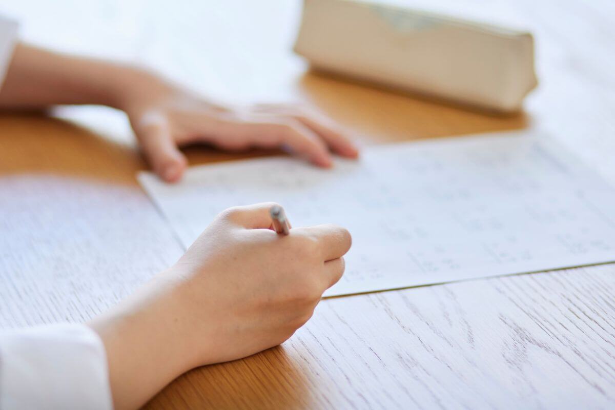 A picture of someone writing.