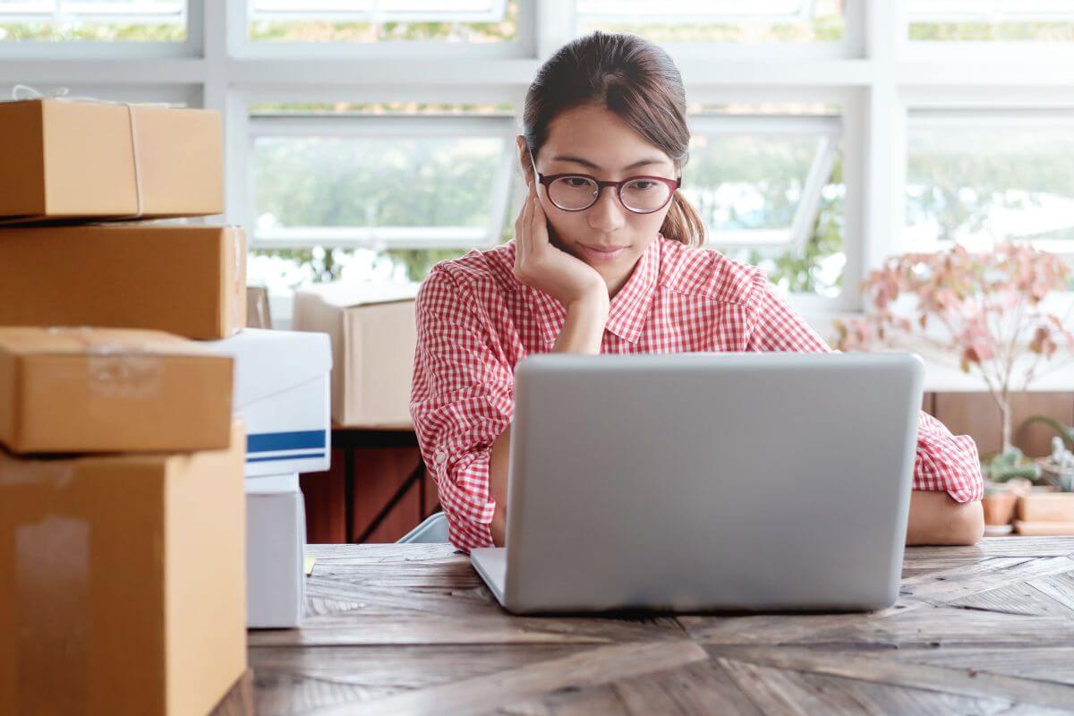 A picture of someone using their laptop.