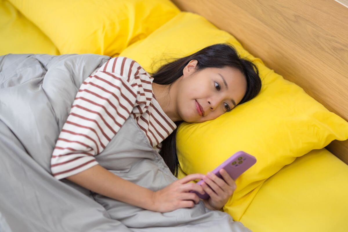 A picture of someone using their phone.