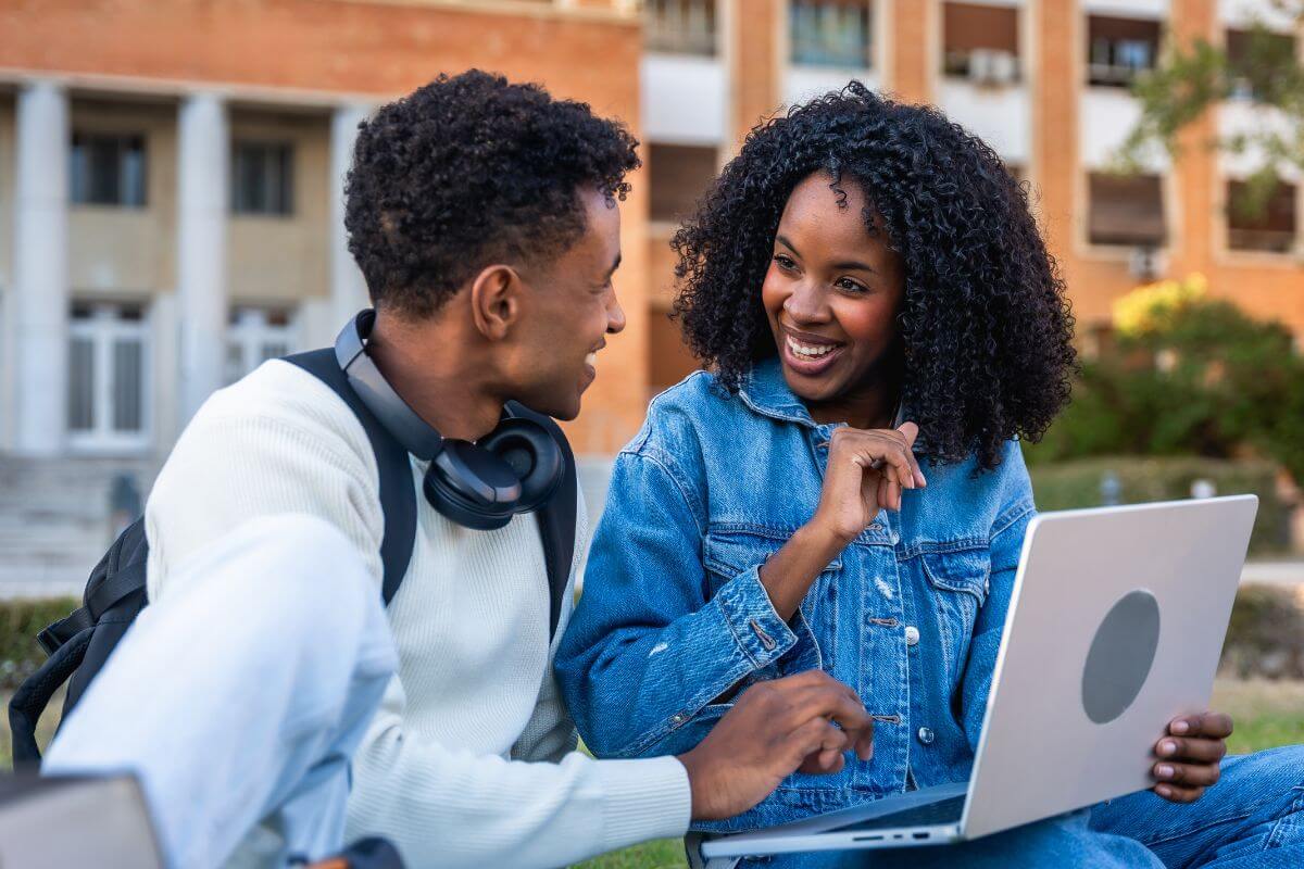A picture of a couple using their laptop.