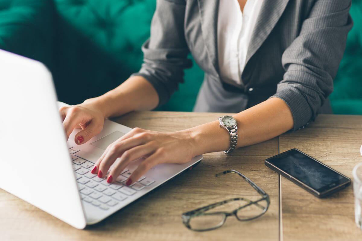 A picture of someone using their laptop.