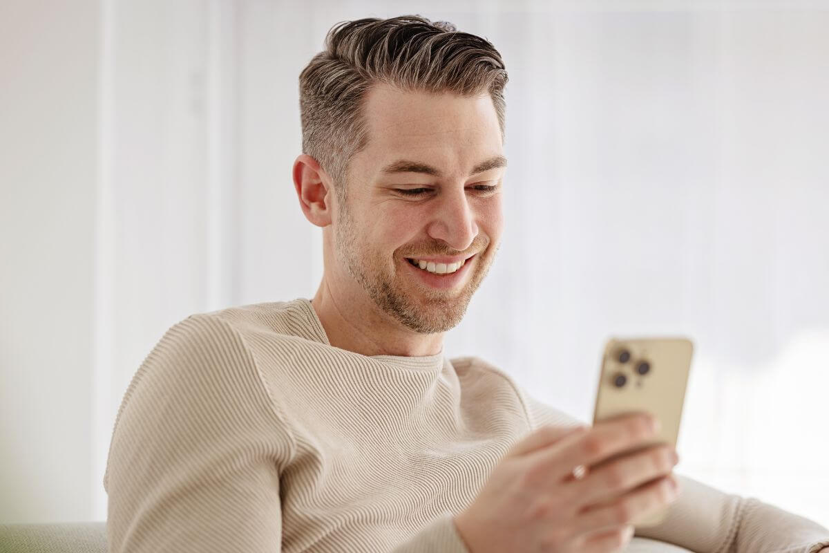 A picture of someone using their phone.