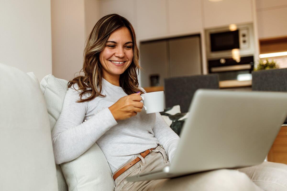 A picture of someone using their laptop. 