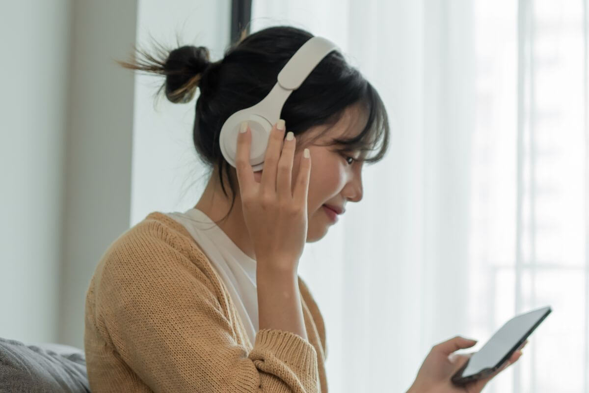 A picture of someone listening to something. 