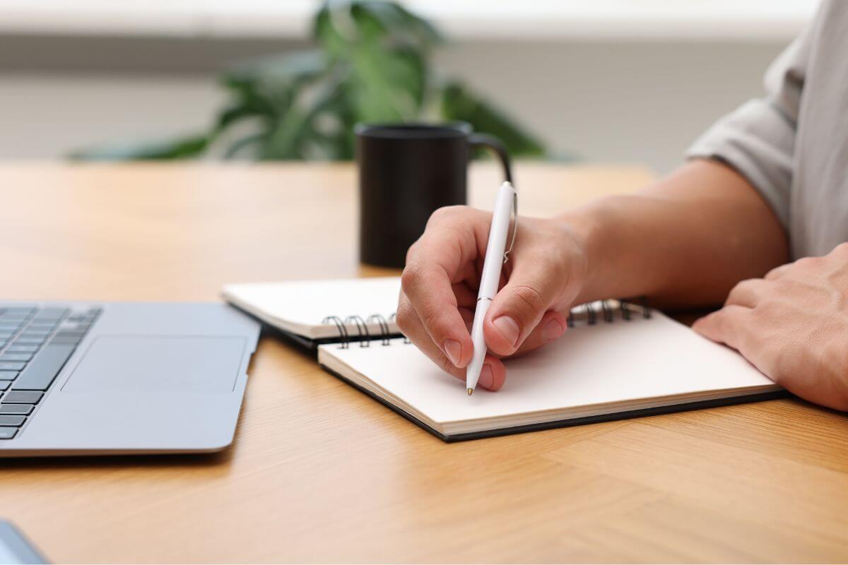 A picture of someone writing. 