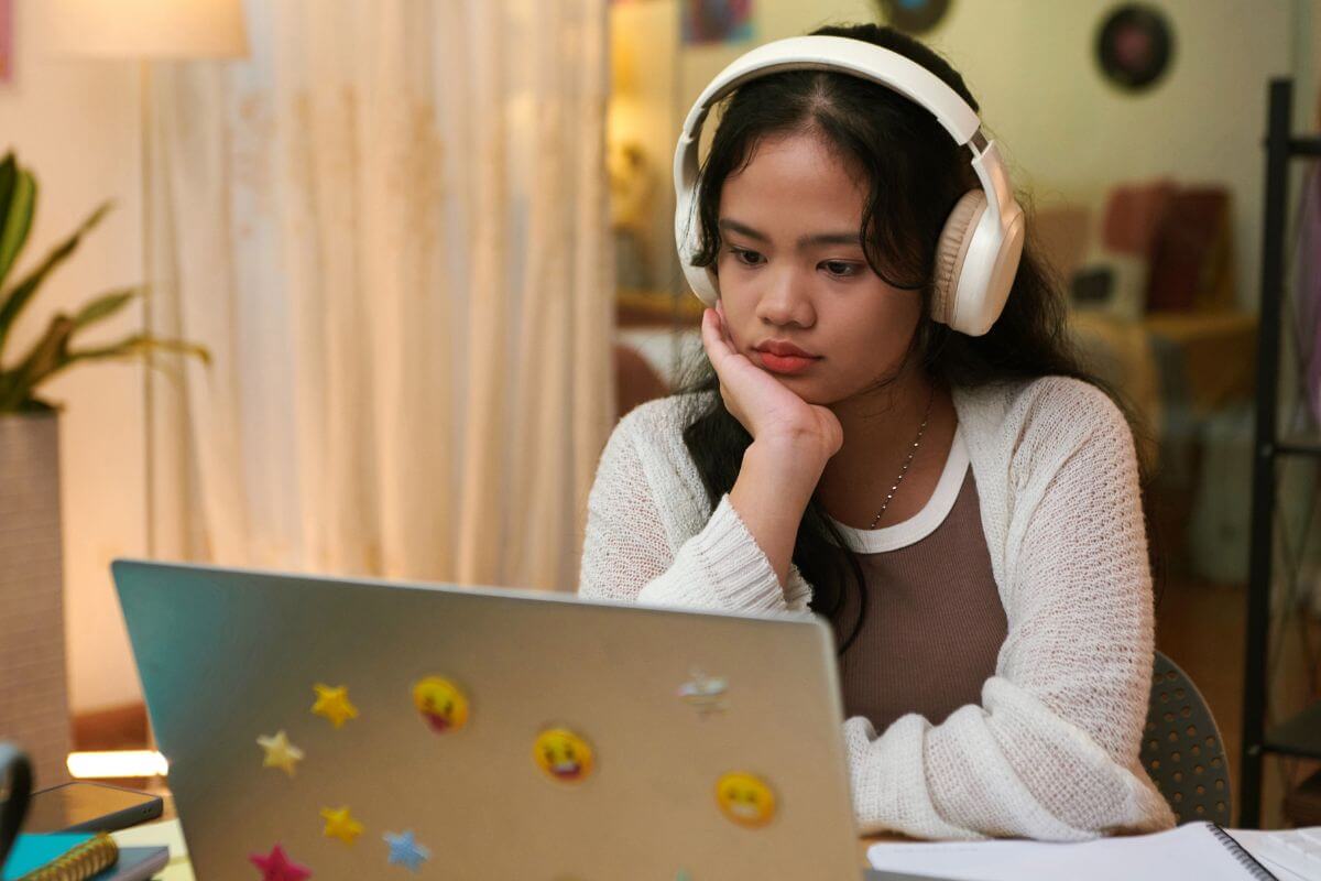 A picture of someone watching something. 