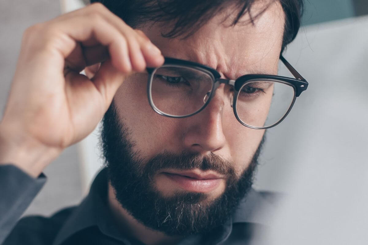 A picture of someone reviewing his papers.