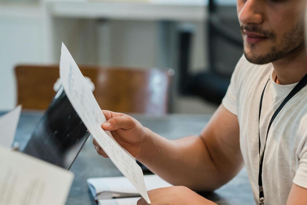 A picture of someone with papers.