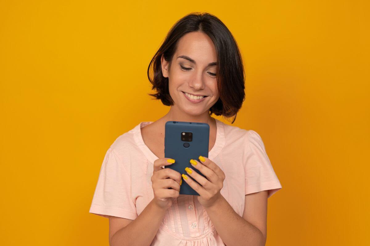 A picture of someone using their phone.