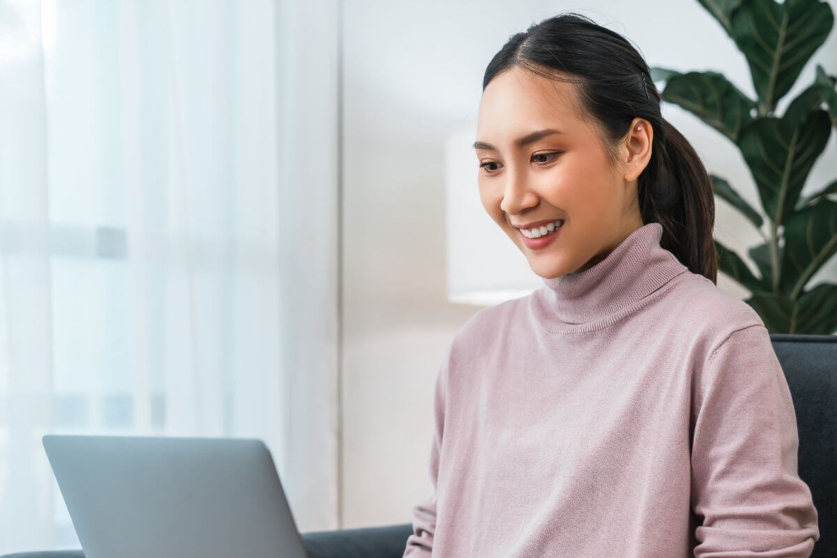 A picture of someone using their laptop.