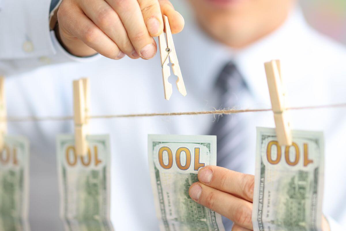 A picture of someone hanging $100s.