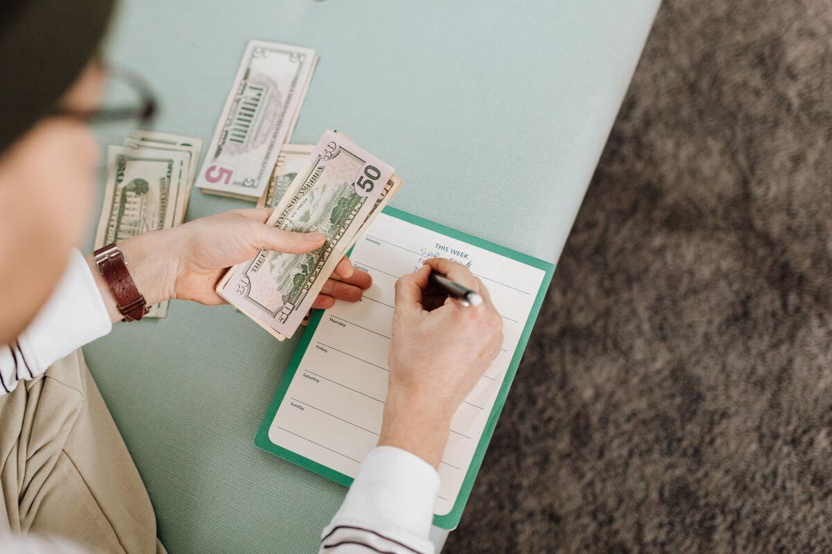 A picture of someone counting money.